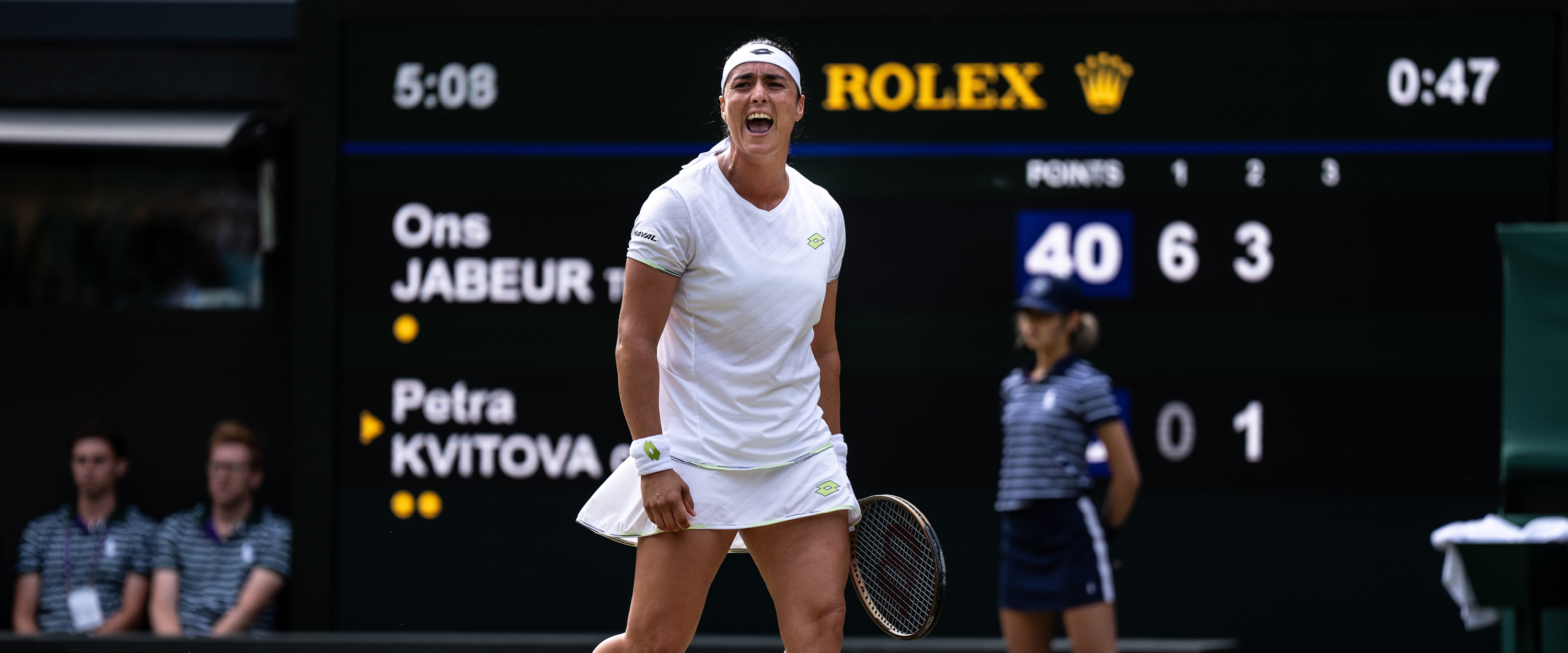 Women's tennis player Ons Jabeur celebrating a shot during a match on Centre Court at Wimbledon in 2023