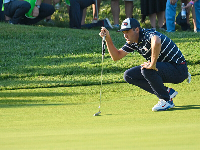 Golf player Scotty Scheffler playing in The Masters 2024 tournament on the course