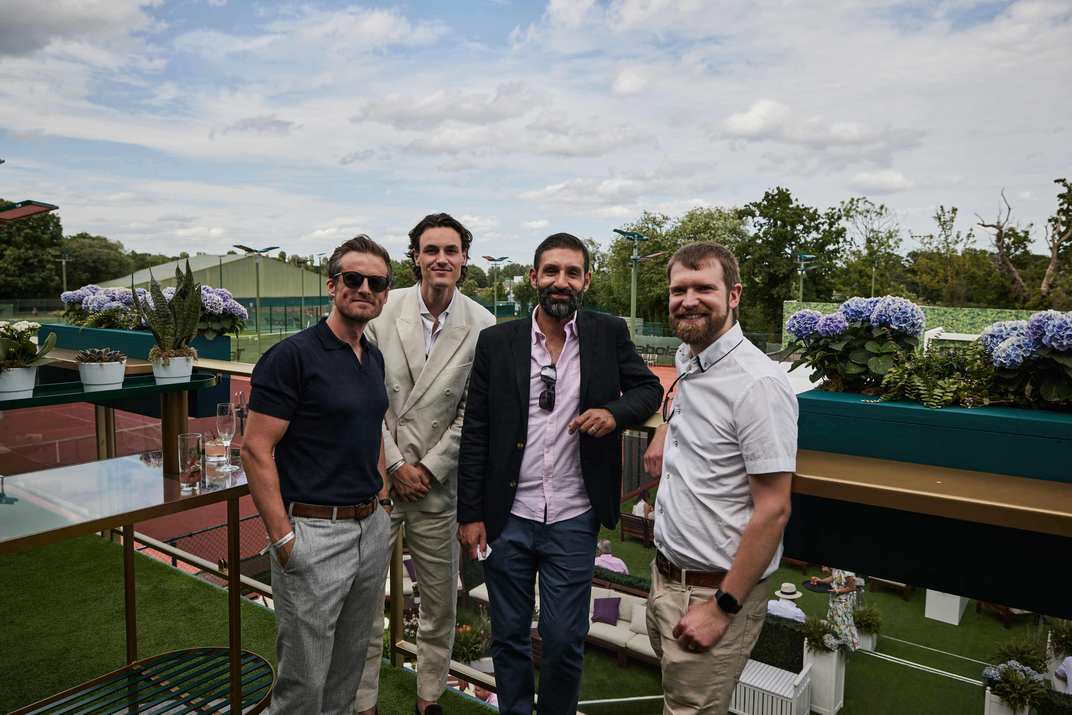 Guests on the balcony at the Treehouse at Wimbledon 