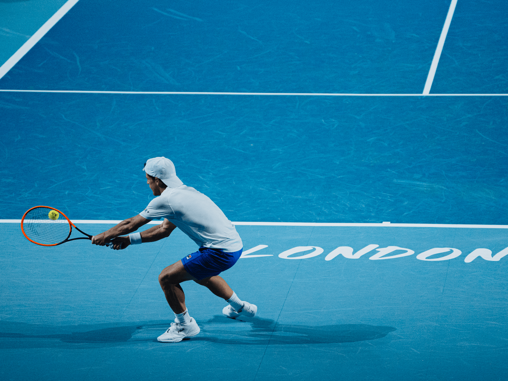 Tennis player Diego Schwartzman hitting the tennis ball during a match at the UTS Grand Final in London in 2023