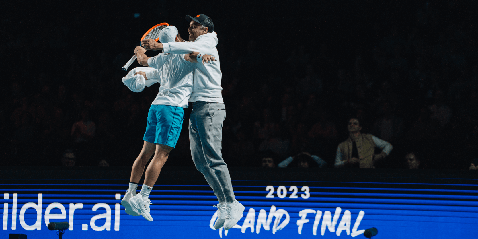 Tennis player Diego Schwartzman jumping and chest bumping a coach during the 2023 UTS Grand Final in London