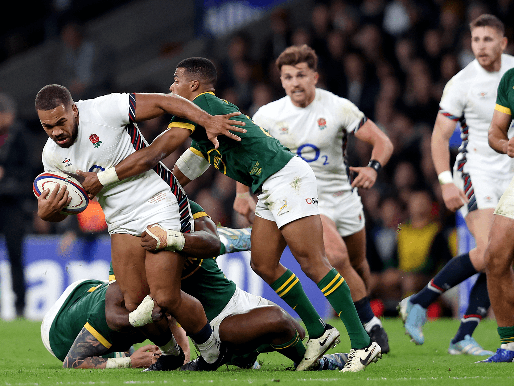 England rugby player Ollie Lawrence running in the Autumn Nations Series at Allianz Stadium against South Africa