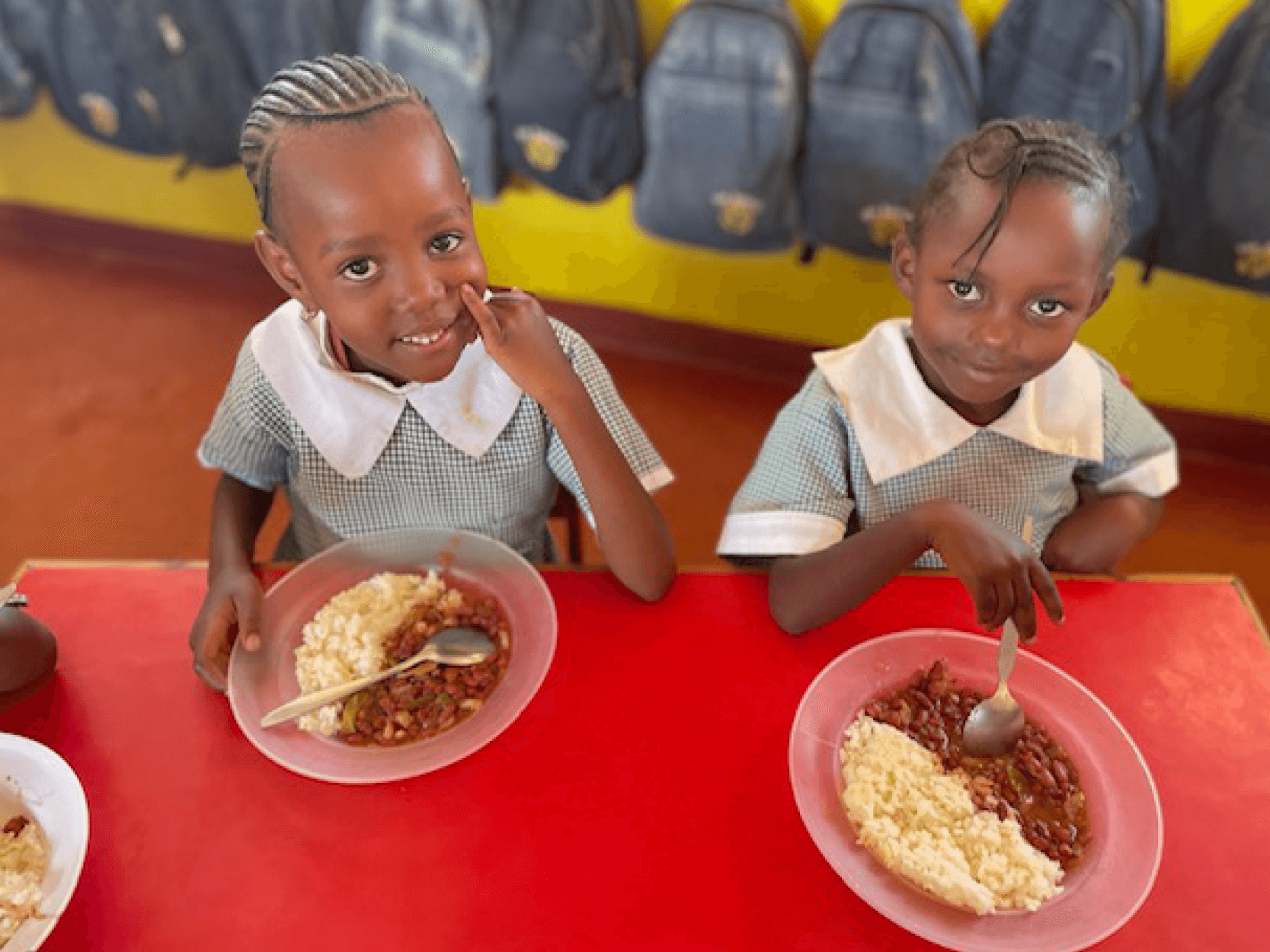 Children from the Baobab charity in a school in Nairobi Kenya eating their lunch with the Keith Prowse feeding programme
