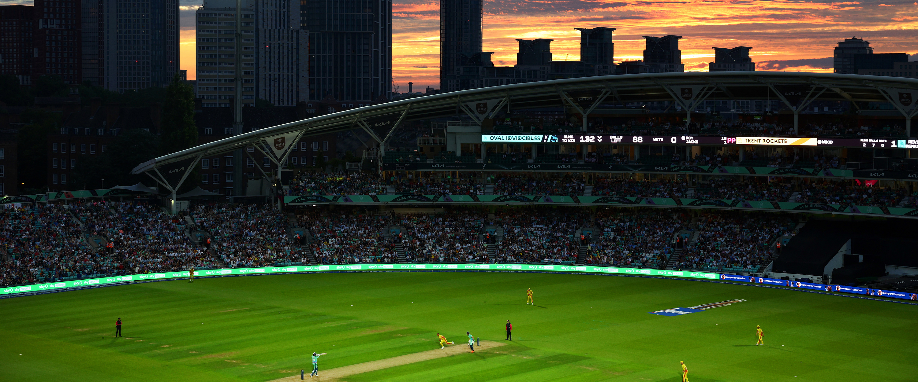 Sunset view of the pitch at The Kia Oval cricket stadium under the lights during a match for The Hundred in 2023 between Oval Invincibles and Trent Rocket men