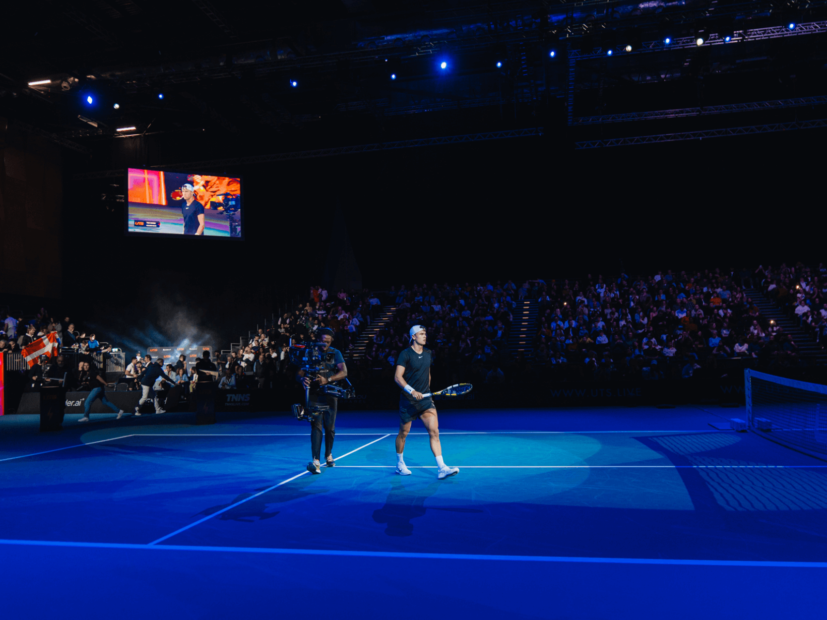 Norwegian tennis player Holger Rune walking out onto court for the UTS Grand Final in London in 2023
