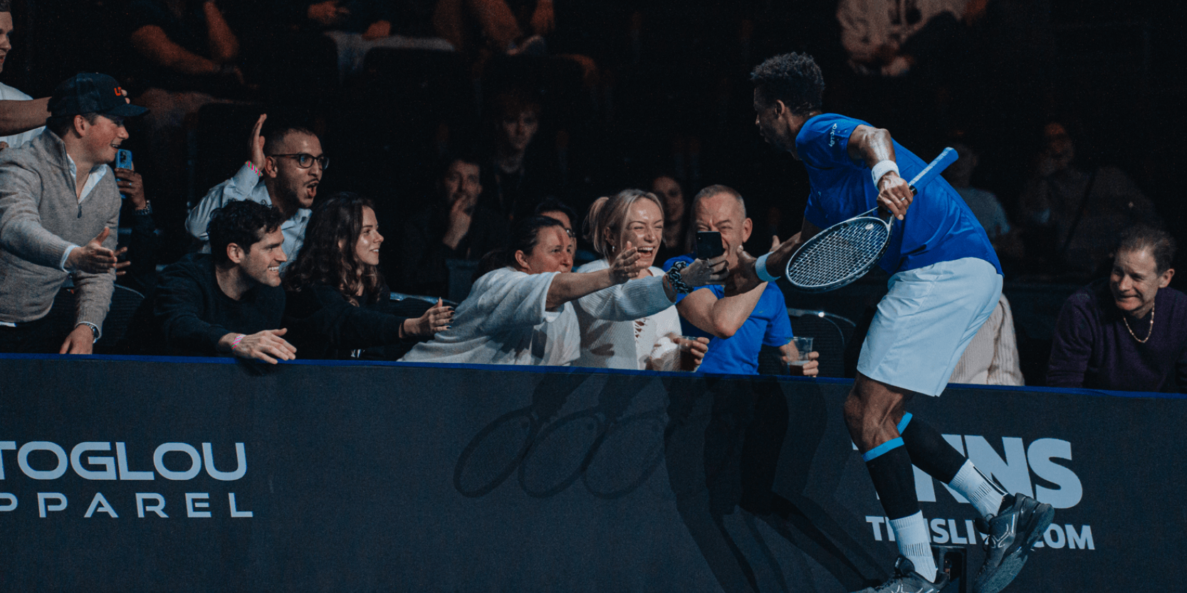 Tennis player Gael Monfils high fiving the fans in the crowd at the UTS Grand Final in London in 2023