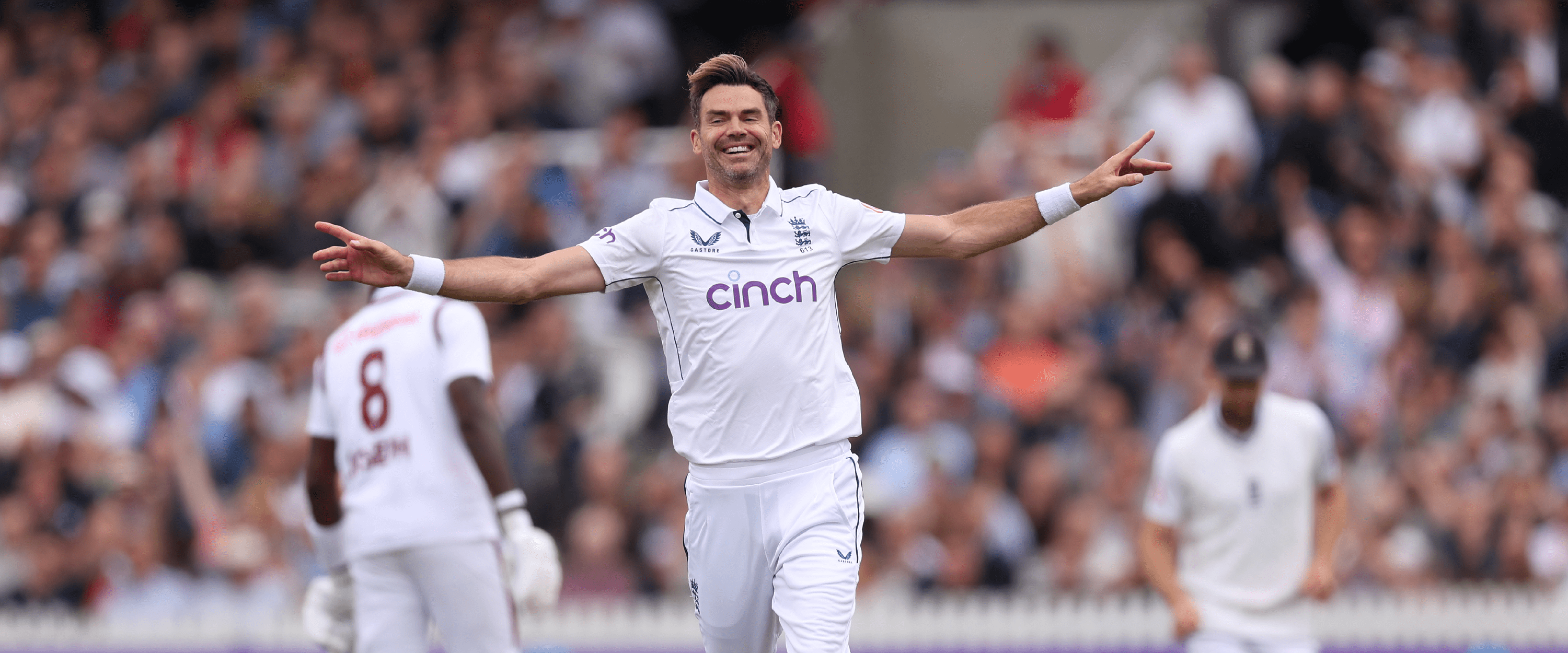 England cricketer James Anderson running and celebrating during a Test cricket match