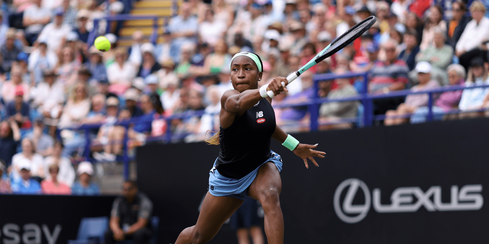 America tennis player Coco Gauff reaching to hit the tennis ball during a match at Eastbourne tennis event in England