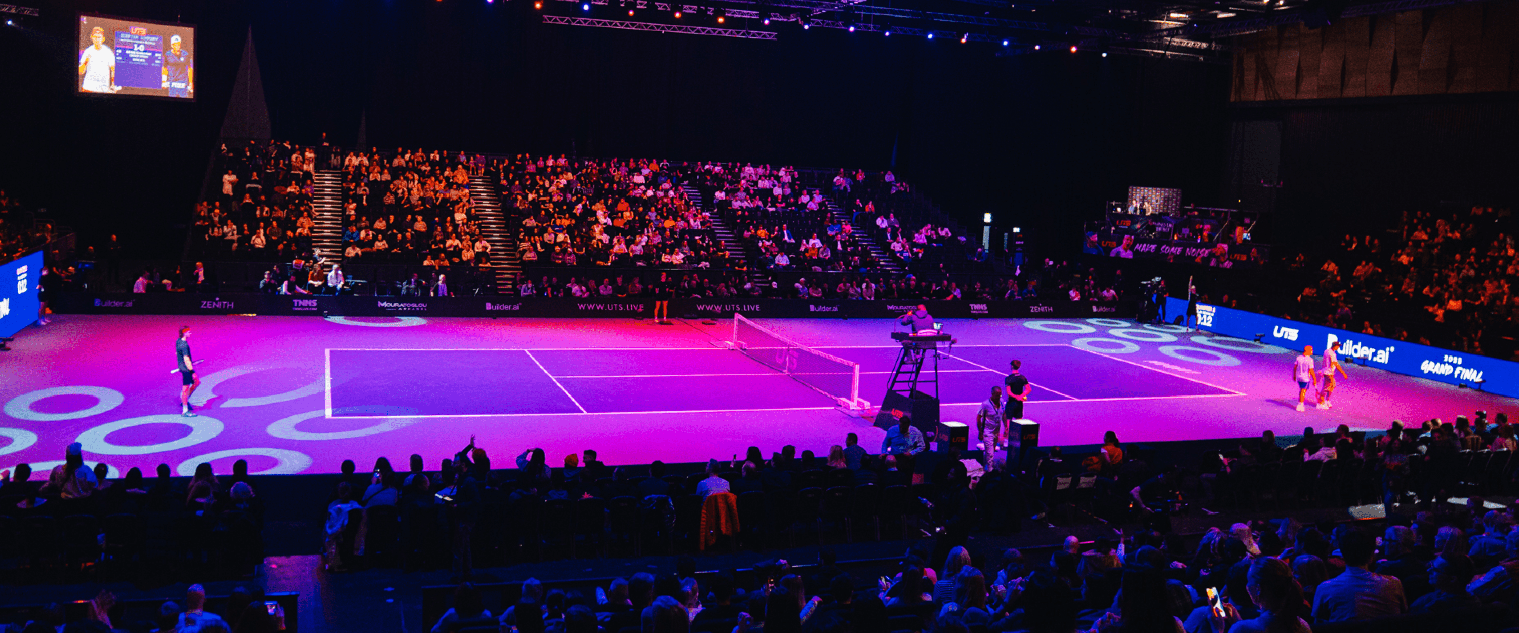 Tennis court for the UTS Grand Final in London at the Copper Box Arena with lights and the crowd