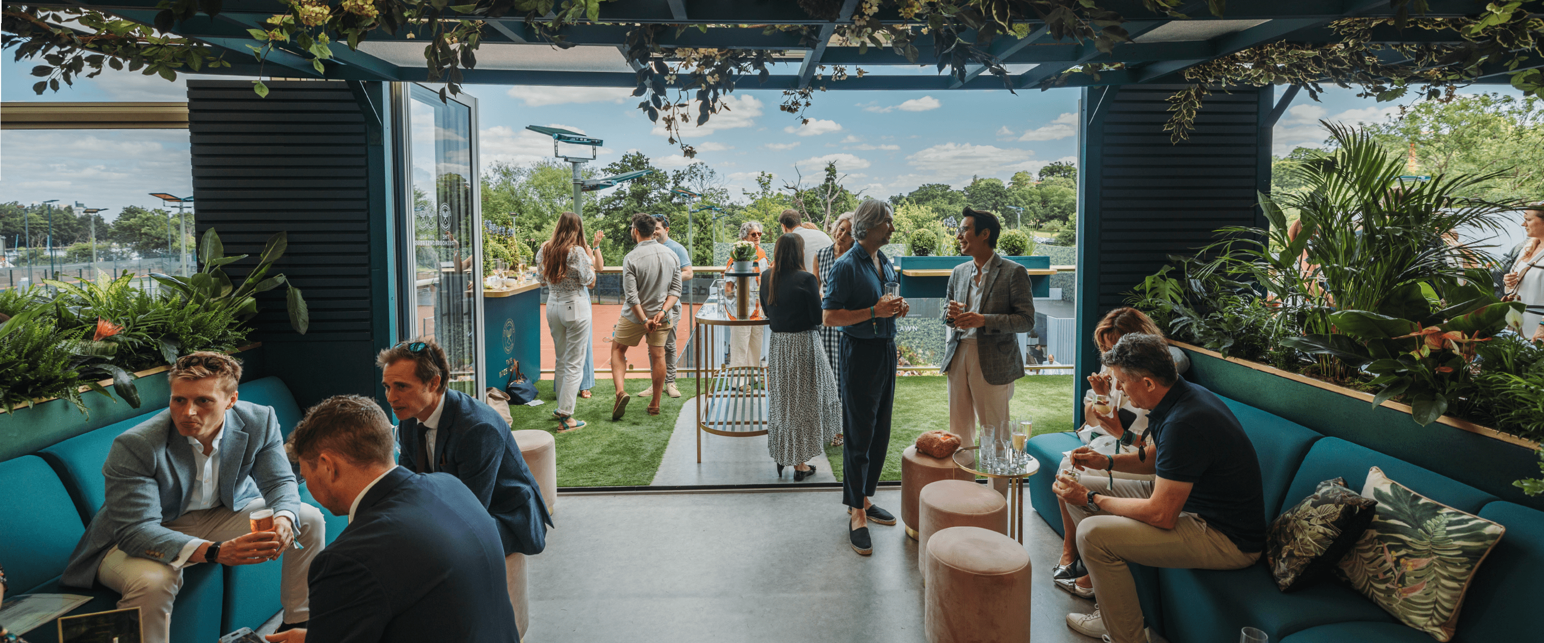 The seating area inside the Treehouse stretching out onto the balcony where guests can sit and enjoy the hospitality experience at Wimbledon