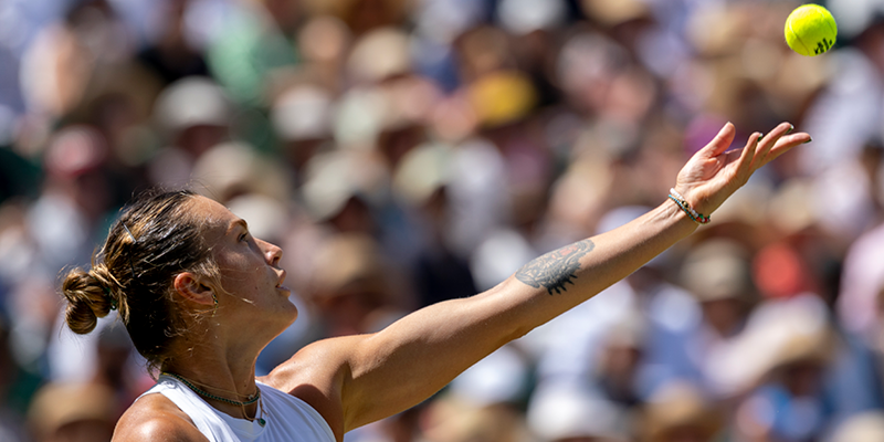 Aryna Sabalenka serving during a tennis major championship Wimbledon