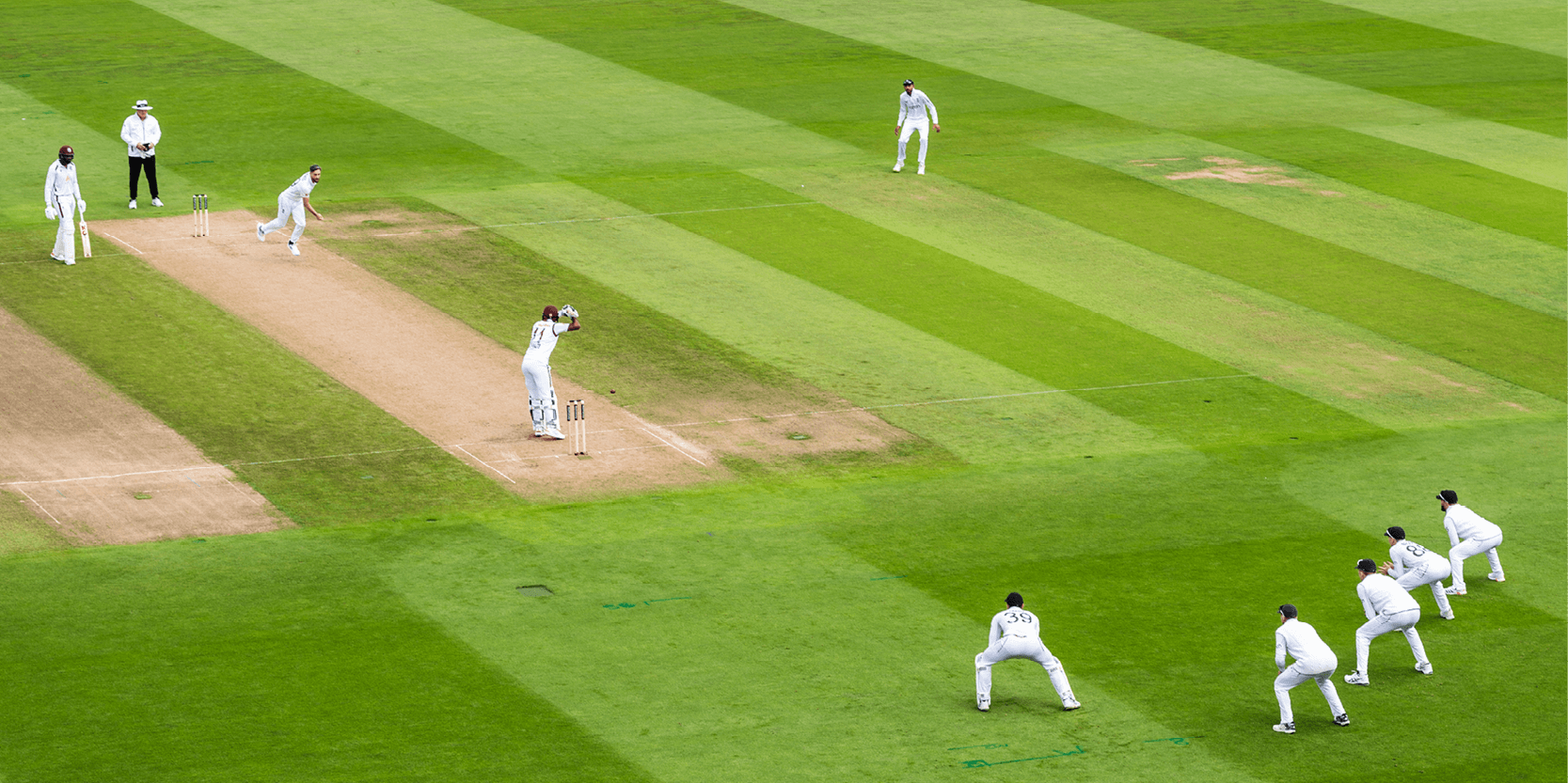 England cricketers playing a Test match on the cricket pitch