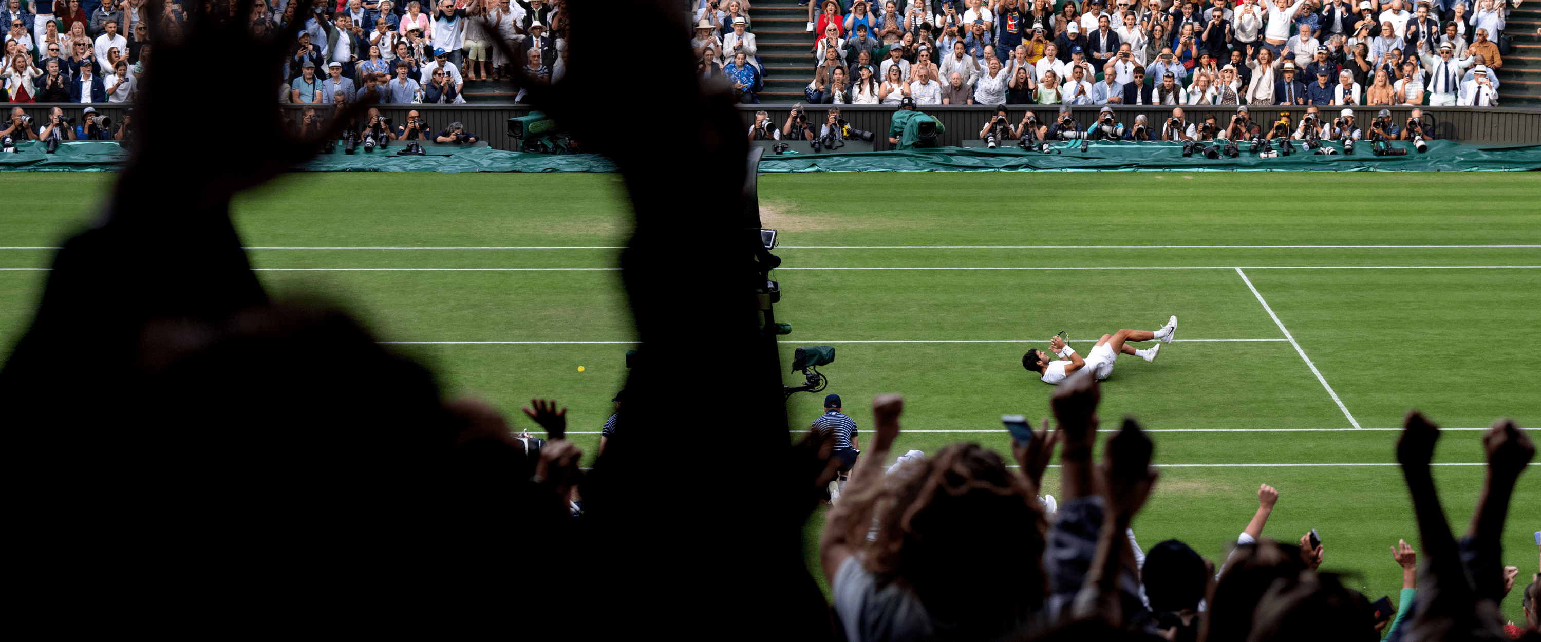 View from the crowd of fans celebrating Carlos Alcaraz winning the 2024 Wimbledon title on Centre Court