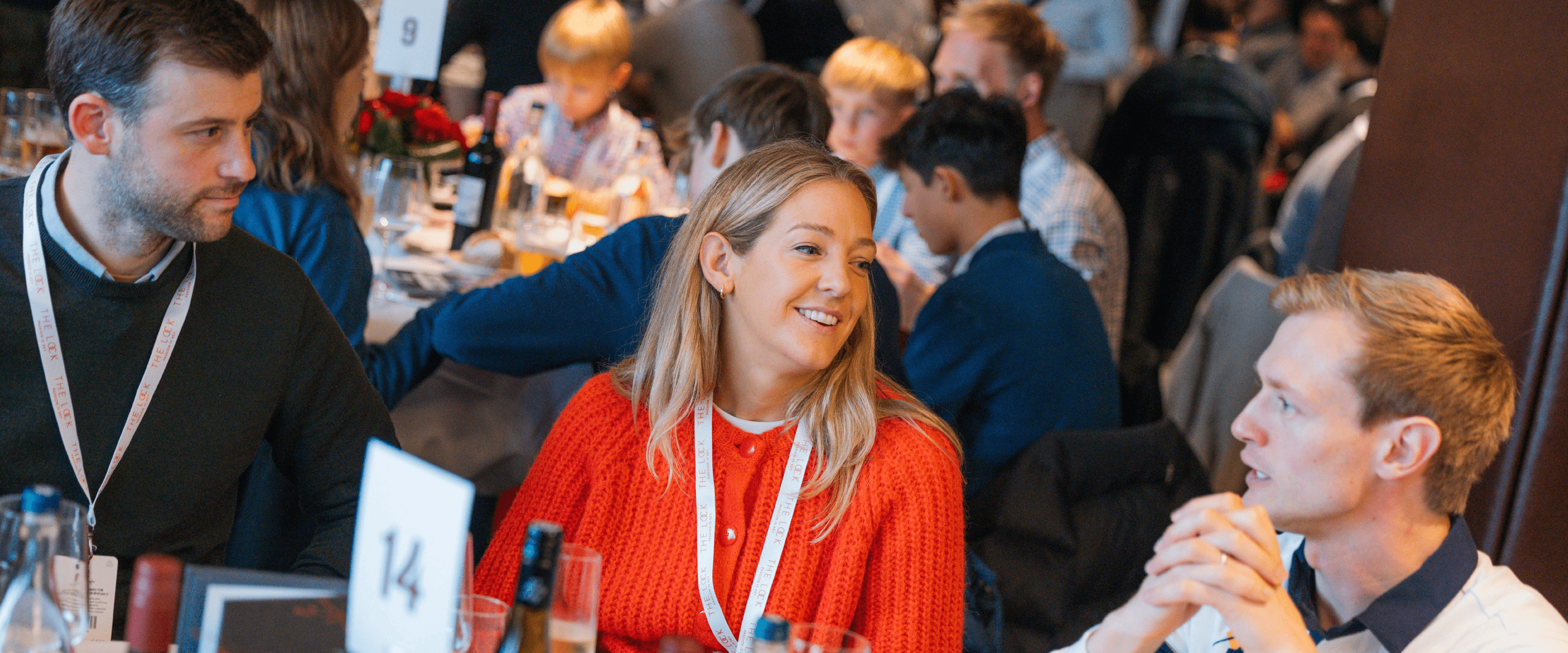 Guests smiling and chatting whilst in The Lock hospitality at an England Rugby match at Allianz Stadium, Twickenham