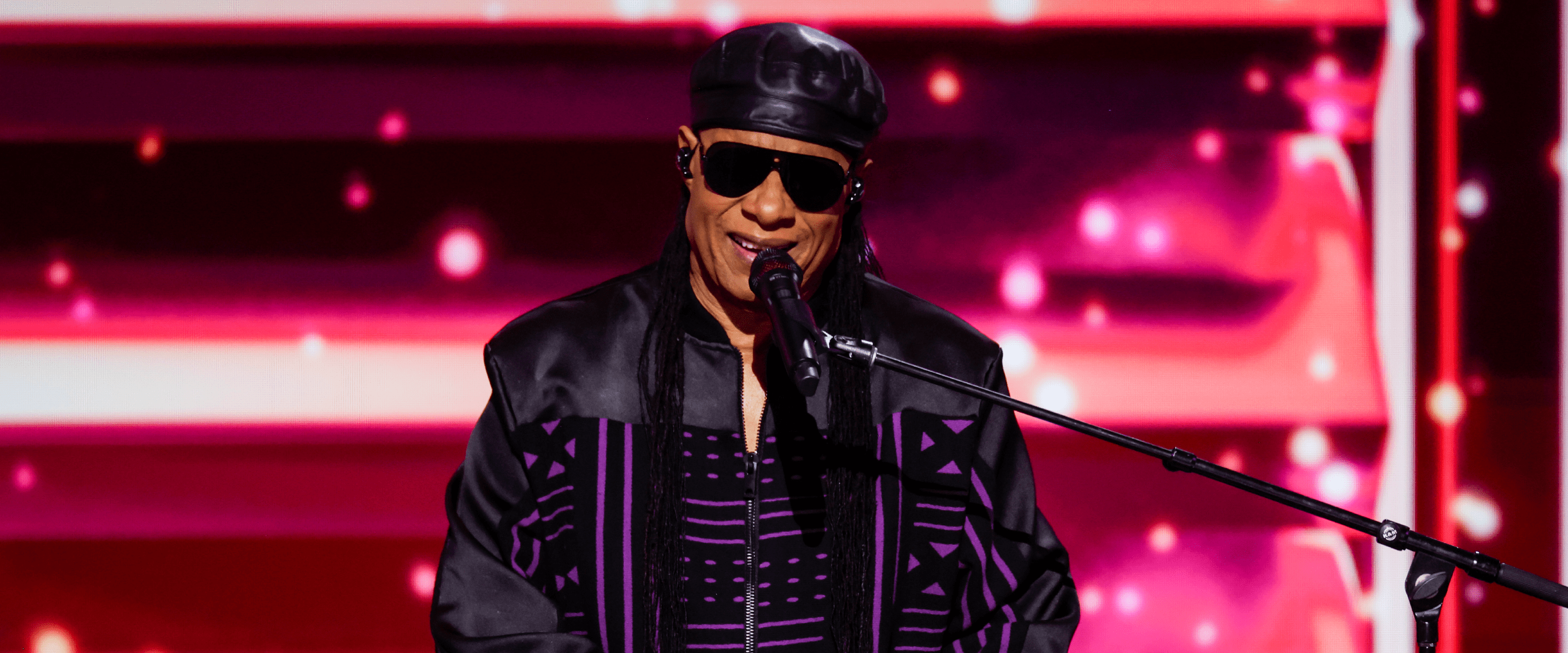 Global music icon and singer Stevie Wonder performing on the piano during a concert