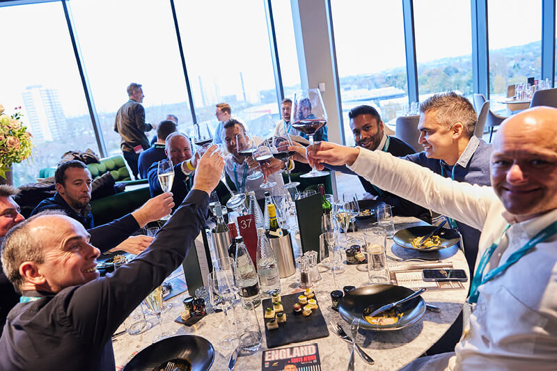 Guests enjoying a sit down meal in The East Wing hospitality at Twickenham Stadium