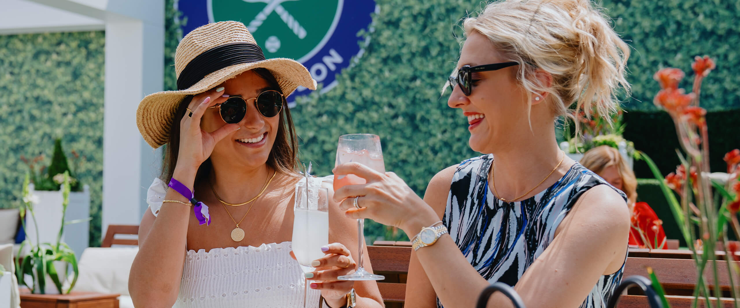 Guests enjoying cocktails at the hospitality space The Lawn at The Championships Wimbledon