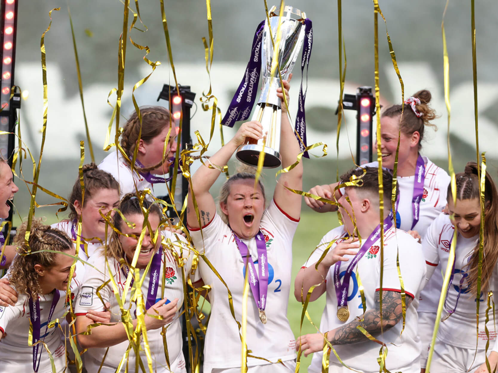 England women's rugby player Marlie Packer lifting the 2023 Six Nations trophy at Twickenham Stadium