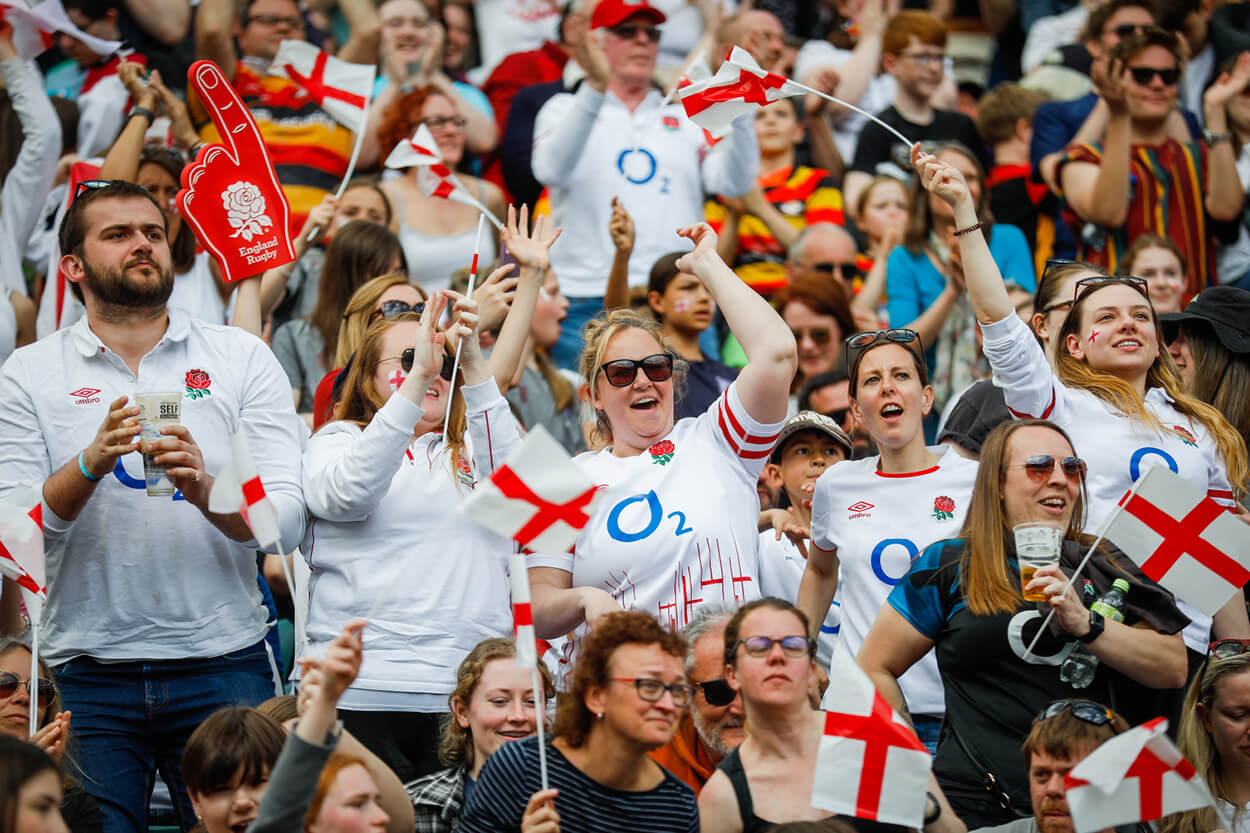 England women's rugby fans cheering in the crowd at Twickenham Stadium for the England v Canada match in 2023