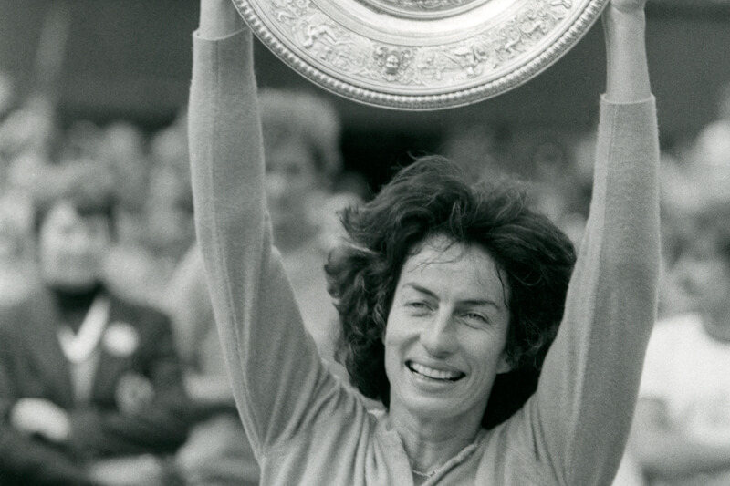Virginia Wade lifting the Championship trophy at Wimbledon