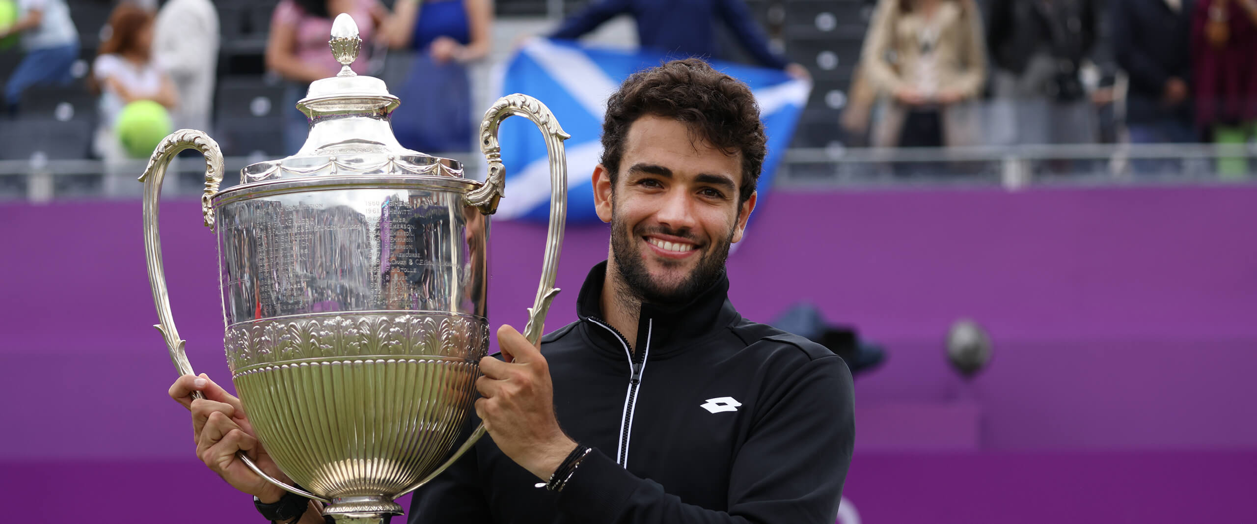Matteo Berrettini holding the trophy for cinch Championships at The Queen's Club in 2021