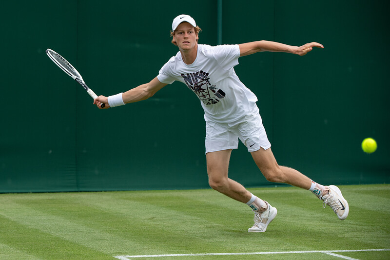 tennis player Jannick Sinner playing in a match at Wimbledon