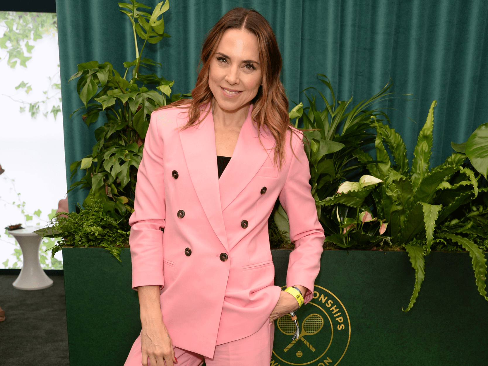 Spice Girls signer Mel C smiling for a photo in the Treehouse at Wimbledon with Keith Prowse