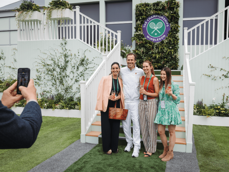 Hospitality guests at Wimbledon taking a photo outside