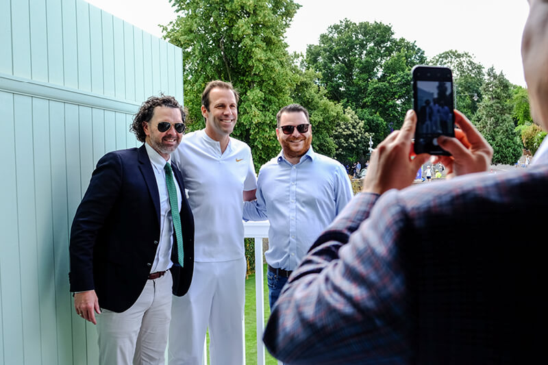 Former British tennis player Greg Rusedski outside Rosewater Pavilion with guests taking photos