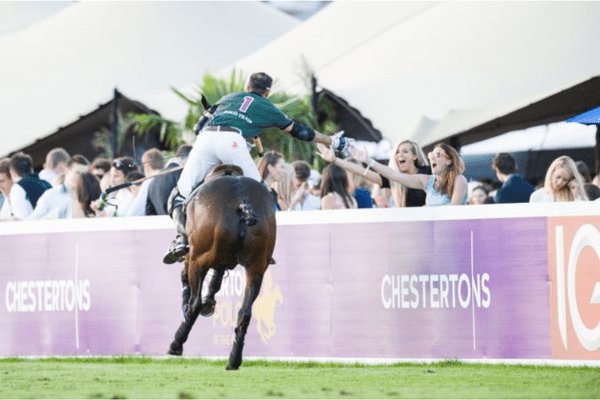 Polo player greeting fans