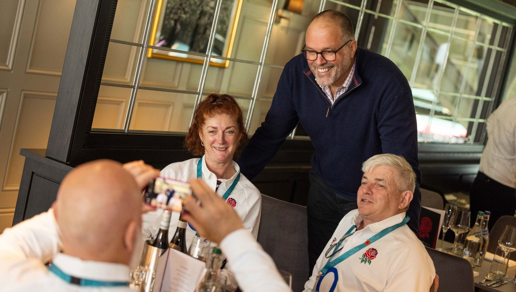 Martin Bayfield taking photo with guests