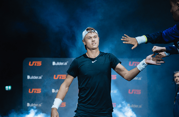 Holger Rune walking out high fiving the fans at UTS tennis tournament in 2023