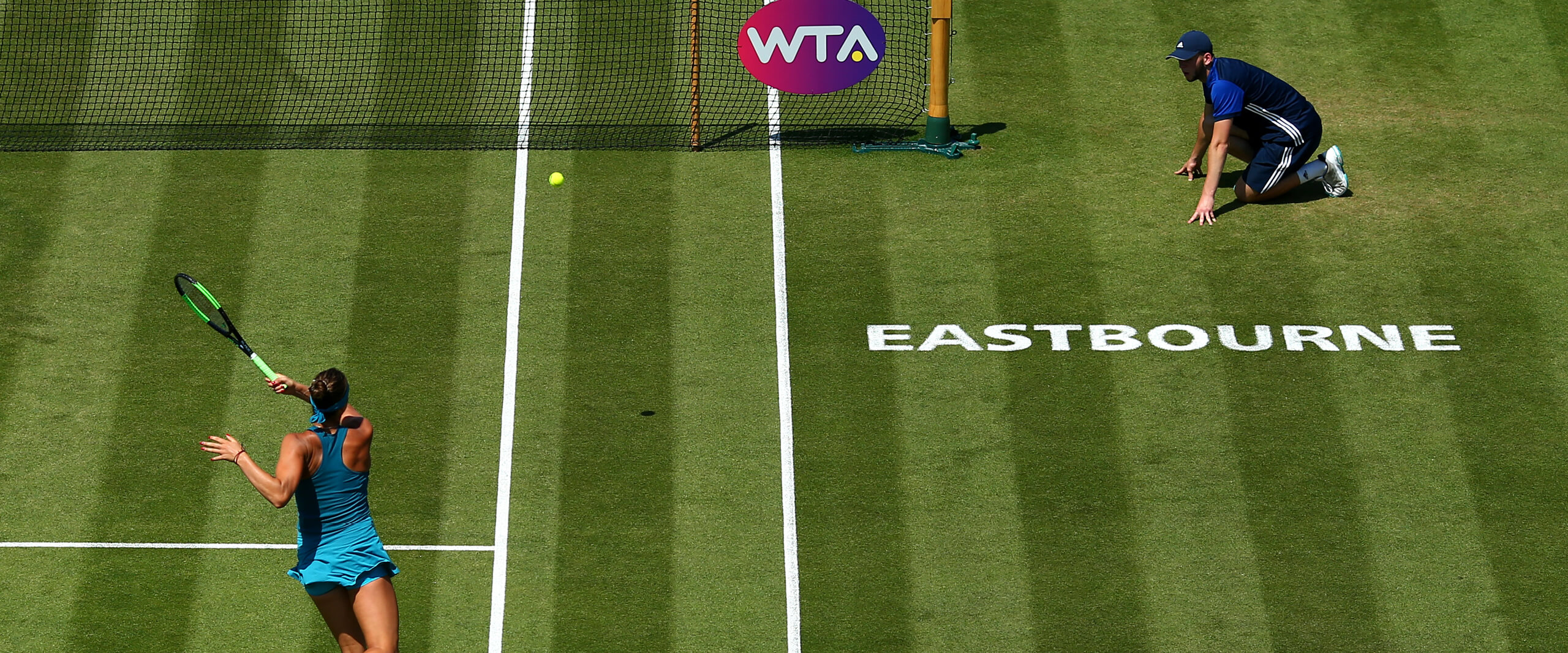 Eastbourne player hiting shot