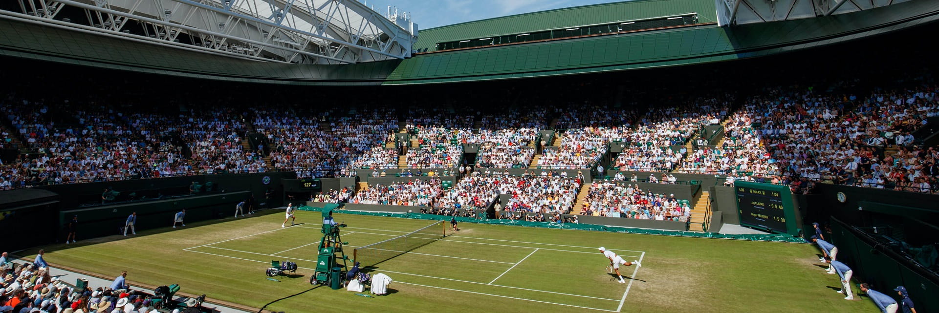 View of the No1 Court at Wimbledon during a tennis match with the roof open