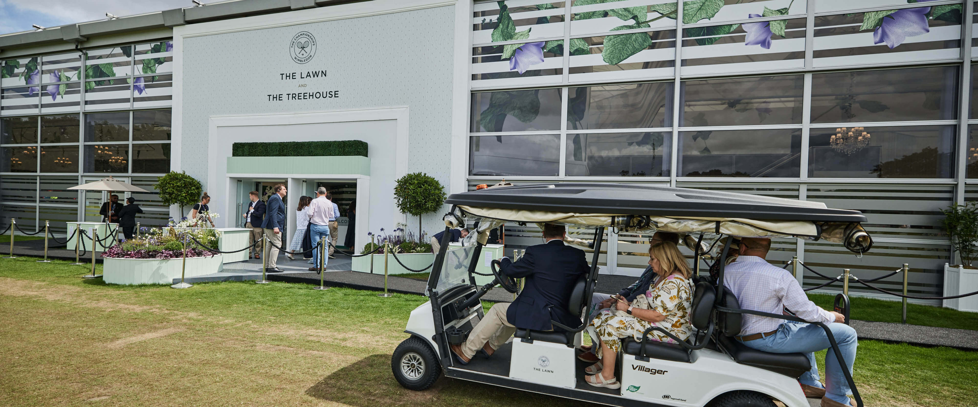 Entrance to The Lawn hospitality facility with golf buggy service taking guests to the Wimbledon grounds at The Championships Wimbledon